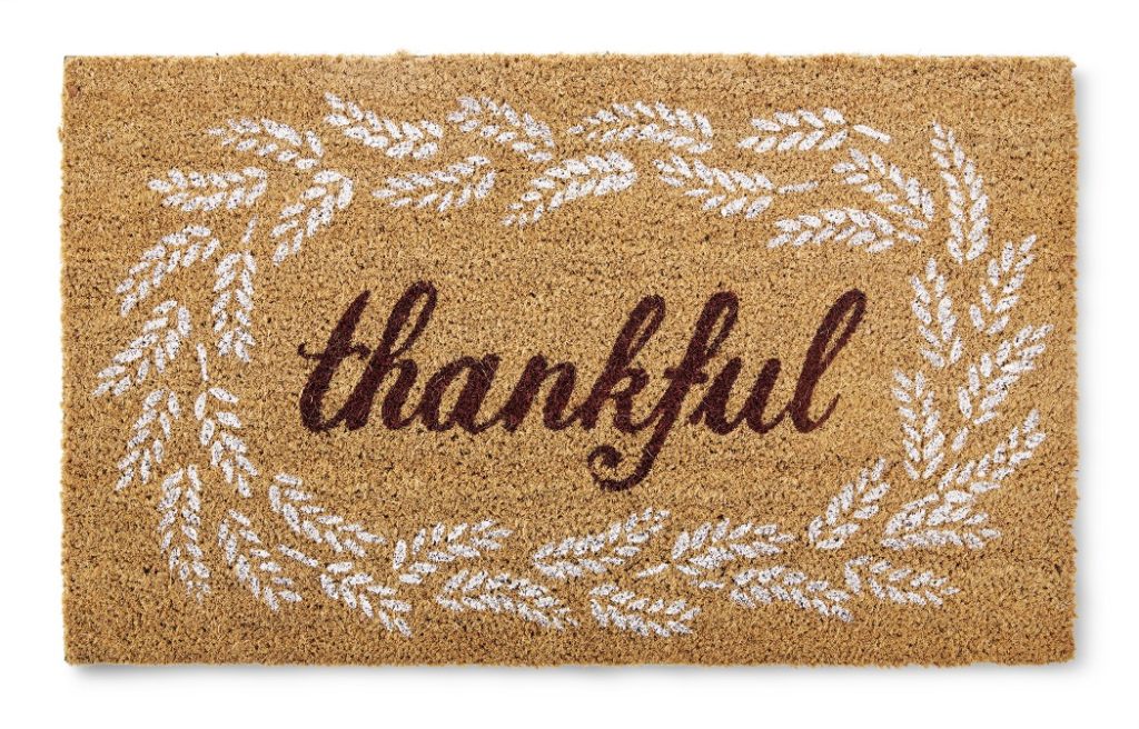 fall doormat with the word thankful 