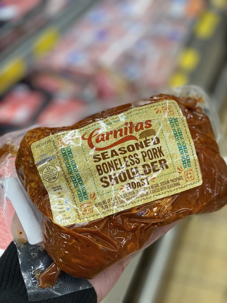 Carnitas Seasoned Boneless Pork Shoulder in the meat case at Aldi